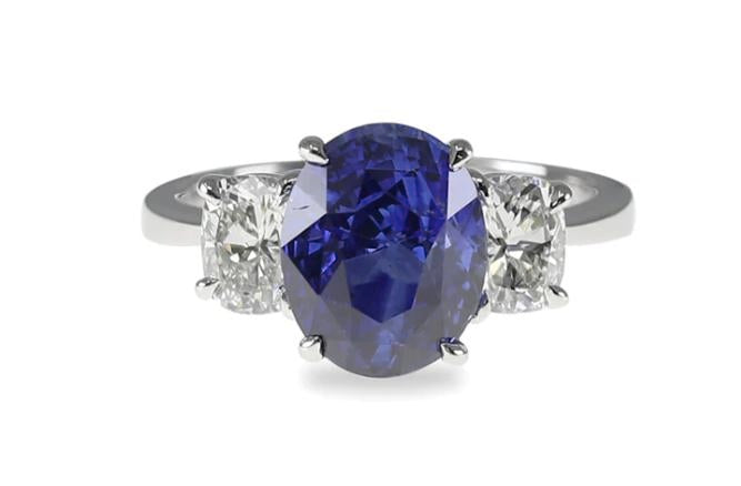 Platinum Oval Sapphire Ring With Oval Diamond Side Accents 