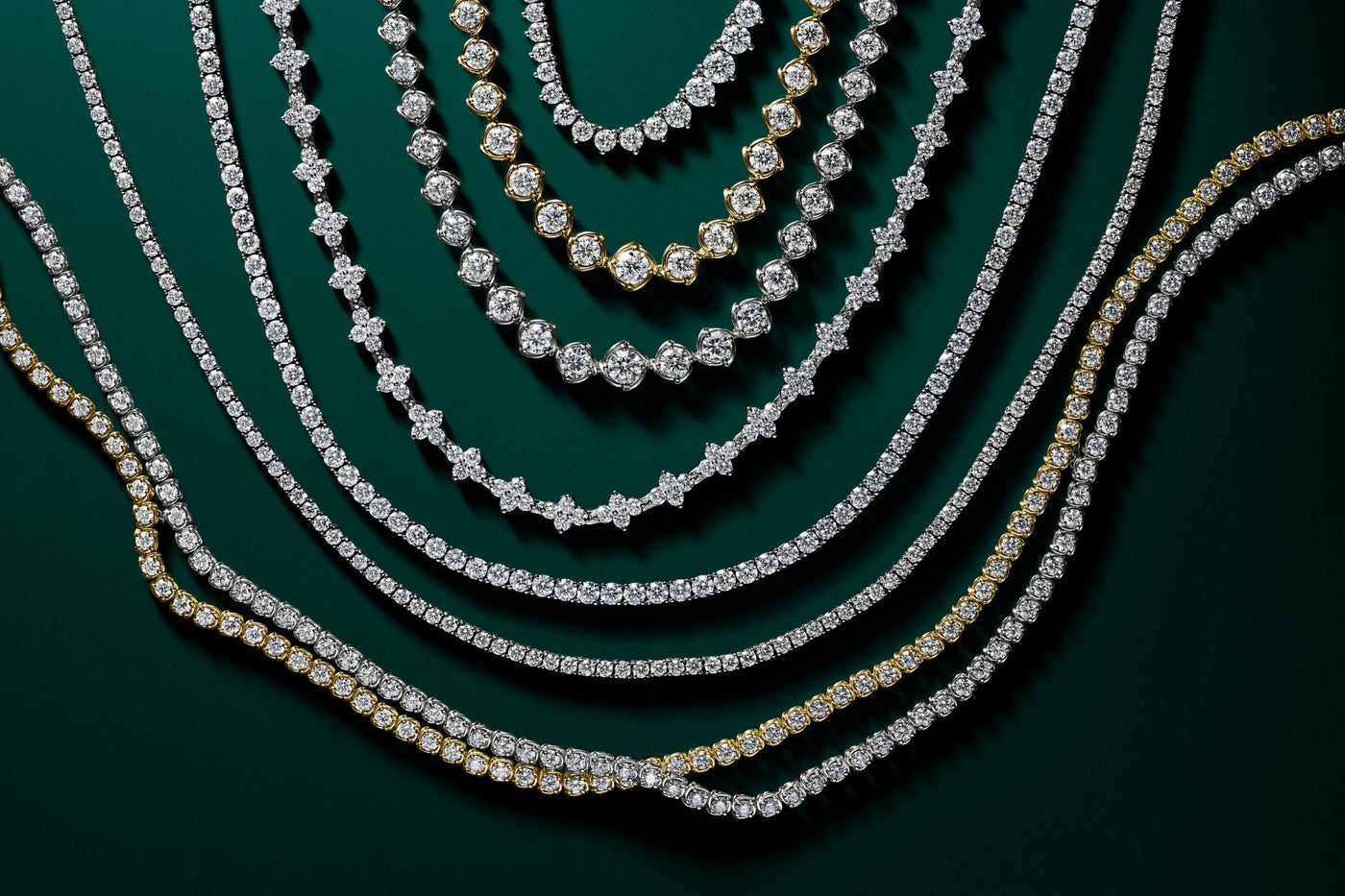 A link diamond riviera necklaces on green backround